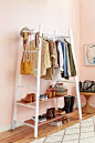 Is it just me or are our closets getting smaller and smaller? There are two ways to combat this problem – get rid of some clothes (which we know is not going to happen), or figure out a way to store more clothes. This is where our ladder DIY may save your