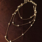 天然小米粒珍珠镀K金色细长项链的图片