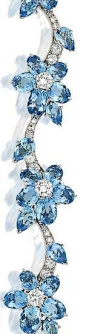 Cartier aquamarine and diamond bracelet, circa 1950 Composed of oval and pear-shaped aquamarine floral clusters with brilliant-cut diamond stamens, on a meandering brilliant and single-cut diamond stem.