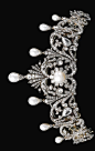 Natural pearl and diamond tiara, late 19th century. Of foliate scroll design, surmounted with seven drop-shaped natural pearls each in a mount embellished with rose diamonds, graduated in size from the centre, the scroll surrounds set with pear-, cushion-