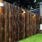 outdoor-design-and-bamboo-fence-panels-for-bamboo-fencing-with-garden-lighting-also-lawn-and-box-planters-with-brick-exterior-siding-plus-window-treatment-and-diy-bamboo-fence                                                                                