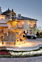 French chateau style driveway with fountain