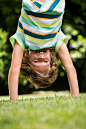 A little boy is playing upside d创意图片素材 - Wavebreak Media RF