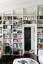 white built-in bookcases. / sfgirlbybay
