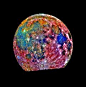  Moon - This image of the Moon was taken by the Galileo spacecraft as it passed by. It is a composite of images taken in three different colors. The color scheme is exaggerated to emphasise composition differences. Blue areas are titanium rich, orange are