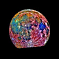 Moon - This image of the Moon was taken by the Galileo spacecraft as it passed by. It is a composite of images taken in three different colors. The color scheme is exaggerated to emphasise composition differences. Blue areas are titanium rich, orange are