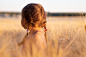 girl wearing pink camisole on brown plant during daytime