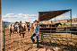 Hispanic rancher smiling near horses by Gable Denims on 500px
