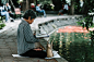 Photo of Woman Sitting While Reading a Book