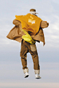 Image may contain Clothing Apparel Human Person Coat and Hat