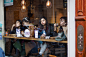 3 women sitting by the table