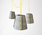 Rainer Mutsch created a limited series of pendant lights for outdoor use made of hand-molded fiber-cement shells and sailing rope.
