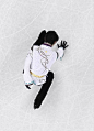 Japanese figure skater Yuzuru Hanyu touches the rink after performing his free skate at the Pyeongchang Winter Olympics in Gangneung South Korea on...