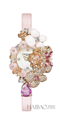 尚美巴黎 (Chaumet) Hortensia Secret钻石腕表，采用一束粉色花朵雕刻造型，珍贵宝石和钻石镶嵌。小时和分钟表针及表盘由珍珠贝母打造。