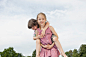 人,休闲装,户外,金色头发,棕色头发_140882774_Germany, Bavaria, Girl giving piggy back ride to boy in park, smiling_创意图片_Getty Images China
