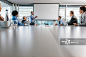 CEO giving a business presentation through projection screen in a board room. - 创意图片 - 视觉中国