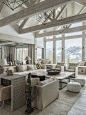 Mountain style formal open concept living room photo with white walls and light hardwood floors