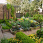 This is an example of a classic courtyard garden in Oklahoma City with a raised bed.
