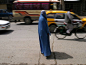 An Afghan woman in a burka crosses a street in Kabul, Afghanistan