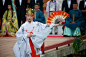 A miko dancing before men and women dressed in heian robes at the Saioh Matsuri.