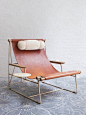 May I introduce you to the most stunning piece of furniture you never knew you needed? This gorgeous chair, with its simple leather seat, bronze frame, shearling pillow and wooden tray, is the brainchild of designer Tyler Hays of BDDW. It's a work of art 