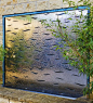 Stainless steel with bronze waves wall water feature for the garden: 
