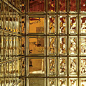 the glass block wall has many different designs on it, including one that is gold