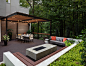 Large trendy backyard deck photo in Atlanta with a fire pit and a pergola