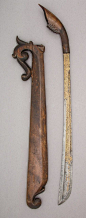 Sword (Rudus) and Scabbard.  Dated: 1835. Inlayer: Muhammad Salih of Terumon (Malaysian, active Kampung Payang, circa 1835). Geography: Kuala Berang. Culture: Malaysian, Kampung Payang, and Sumatra, Aceh. Medium: steel, wood, horn, gold. |  Copyright © 20