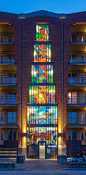 stefan glerum spans stained glass façade across amsterdam housing complex