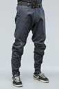 Again an aggressive silhouette from Acronym. These pants have just as much end use as a cargo pant would without all of the external pockets and zippers. It utilizes articulated seams, hidden zippers, and large hidden pocket openings to achieve a wide ran