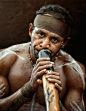 Aborigine men playing a Didgeridoo | Australia