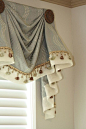 Gathers, pleats, fabulous details, and trim where the valance and band meet.