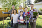 Portrait of smiling multi-generation family gardening by Hero Images on 500px