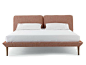 Yuva, designed by the duo Sezgin Aksu and Silvia Suardi for De Padova, is a bed conceived in an absolutely innovative way: a sort of upholstered “tray” supported by wooden legs forms the base where the mattress rests.