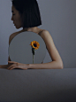 A mirror, an arm, a flower, a piece of fruit: the surreal self-portraits of Liu Ziqian :   