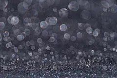 抽象的背景。美丽的暗银色抽象闪光。发光的魔法散景。节日的气氛中。副本的空间。