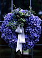 Beautiful blue/violet hydrangae wreath with sage green berries and leaves with pale blue ribbon