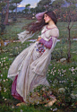 《风之花》, John William Waterhouse. 1903。 约翰·威廉姆·沃特豪斯的绘画构成以雅致见长，极富浪漫主义的特质。这幅画中一位美丽的少女在林间采摘银莲花，在风中飘拂的头发和衣裙让她看起来如此脆弱，似乎就在下一刻她也将随风而去…