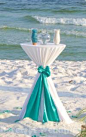 Barefoot Weddings® / Instead of unity candles, bride and groom each has a glass vase full of colored sand that they pour into glass jar: