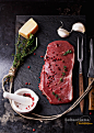 Raw striploin beef steak on black background by Sebastiana on 500px