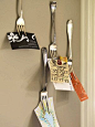 Forks for holding items up. I love the idea of hanging printed out recipes from a fork on a kitchen wall