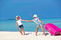 Little adorable girls with big suitcase on tropical white beach by Dmitry Travnikov on 500px