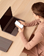 woman-sitting-her-laptop-using-smartphone_23-2148794568