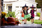 three-children-in-halloween-costumes-trick-or-treating-1