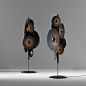 This may contain: two speakers are standing next to each other on metal poles with lights in them and one speaker is turned upside down