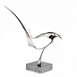 Limited edition (1/20) stainless steel sculpture titled "Volar", created in 1990 and signed by artist Lou Pearson. Mounted on a black marble base. Appropriate or an outdoor/garden installation.      This sculpture is just one of hundreds of piec