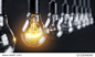 The glowing electric bulb lamp in a row of lamps. The unique concept. 3d illustration