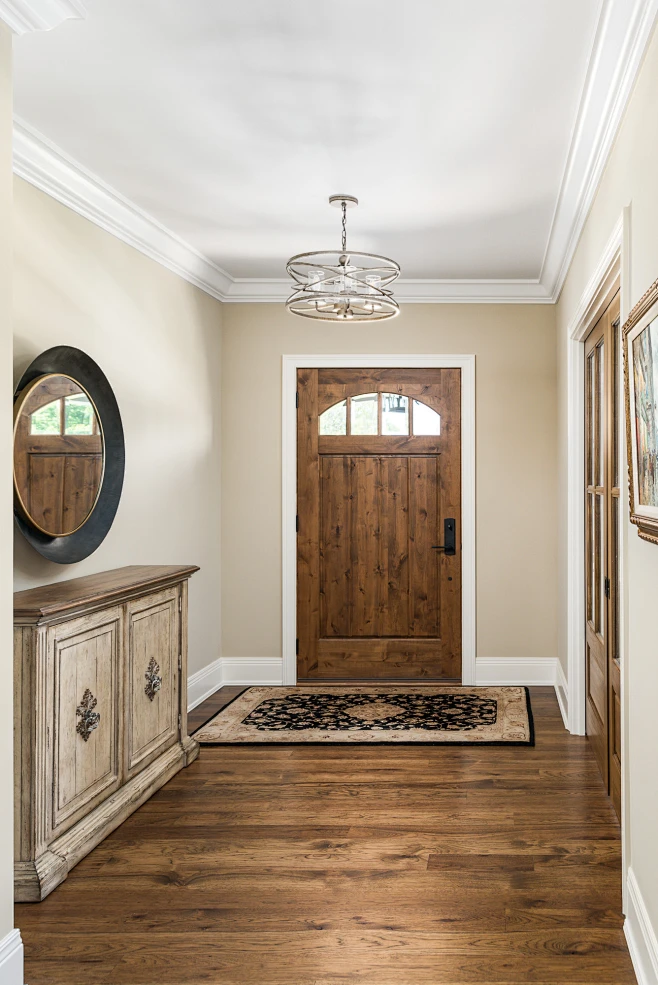 Large elegant dark wood floor and brown floor entryway photo in Chicago ...