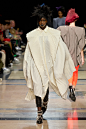 Image may contain Human Person Clothing Apparel Runway and Fashion